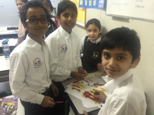 Ameer, Shayaan, Rana and Abdullah, building simple machines using lego.